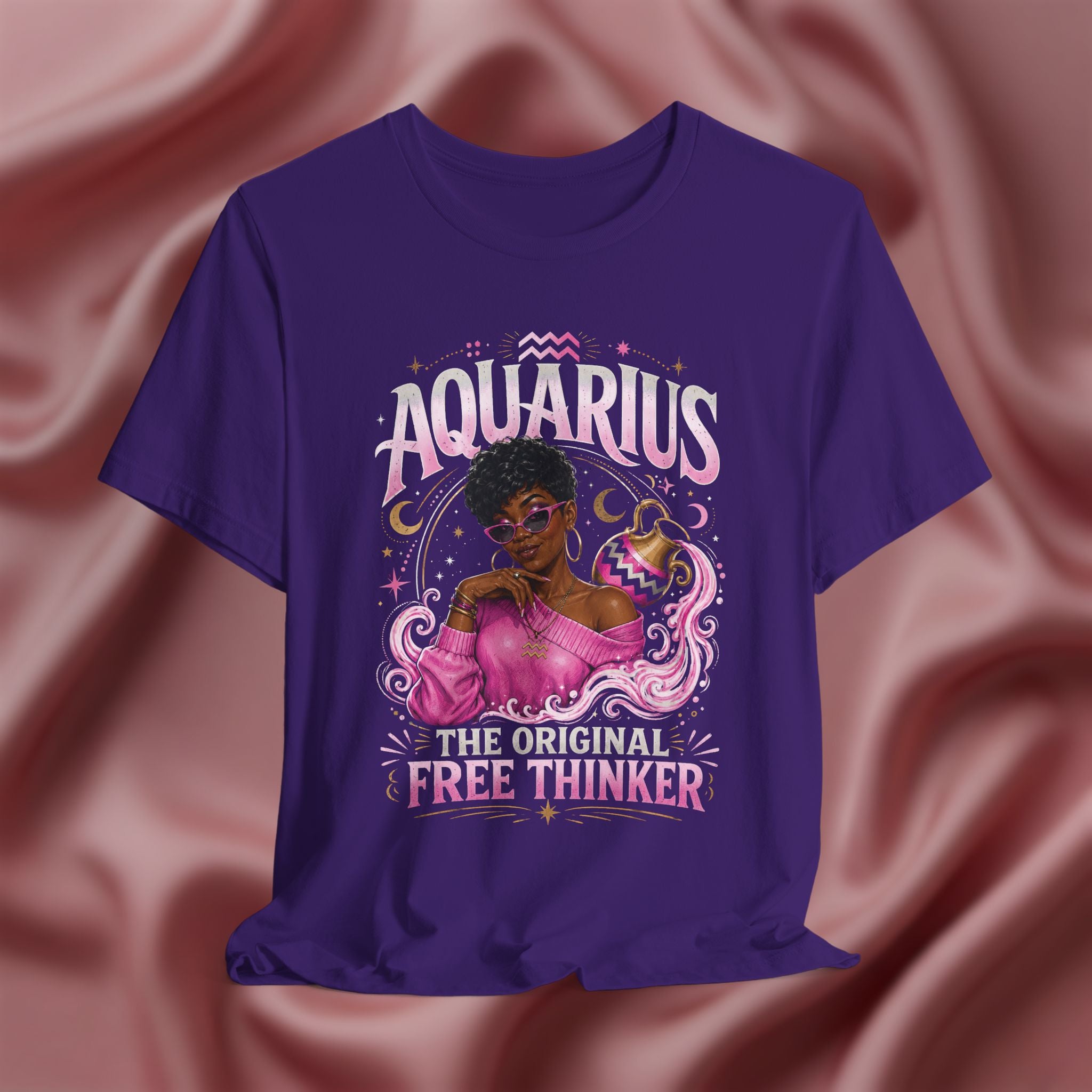 Purple t-shirt with Aquarius design featuring a black woman and text 'Aquarius The original free thinker' on a pink fabric background