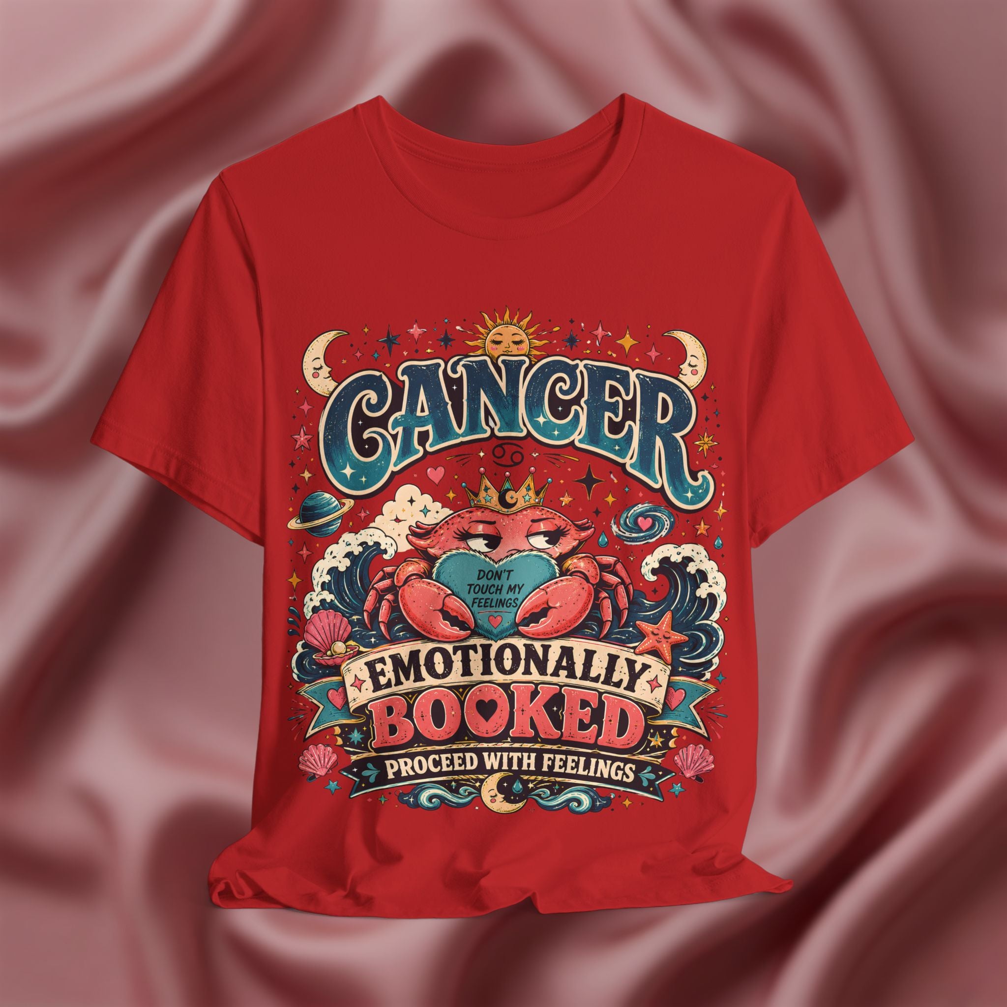 Red t-shirt with Cancer zodiac design on a textured red background