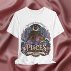White t-shirt with Pisces zodiac design on a maroon fabric background