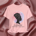 Pink t-shirt with a silhouette of a woman and 'Gemini Divinely Aligned' text on a pink fabric background