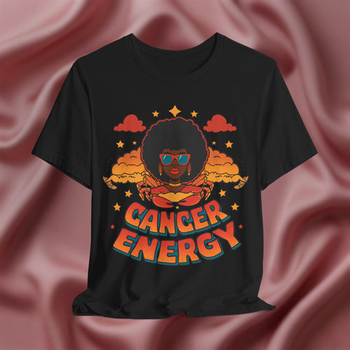 Black t-shirt with 'Cancer Energy' design on a pink fabric background