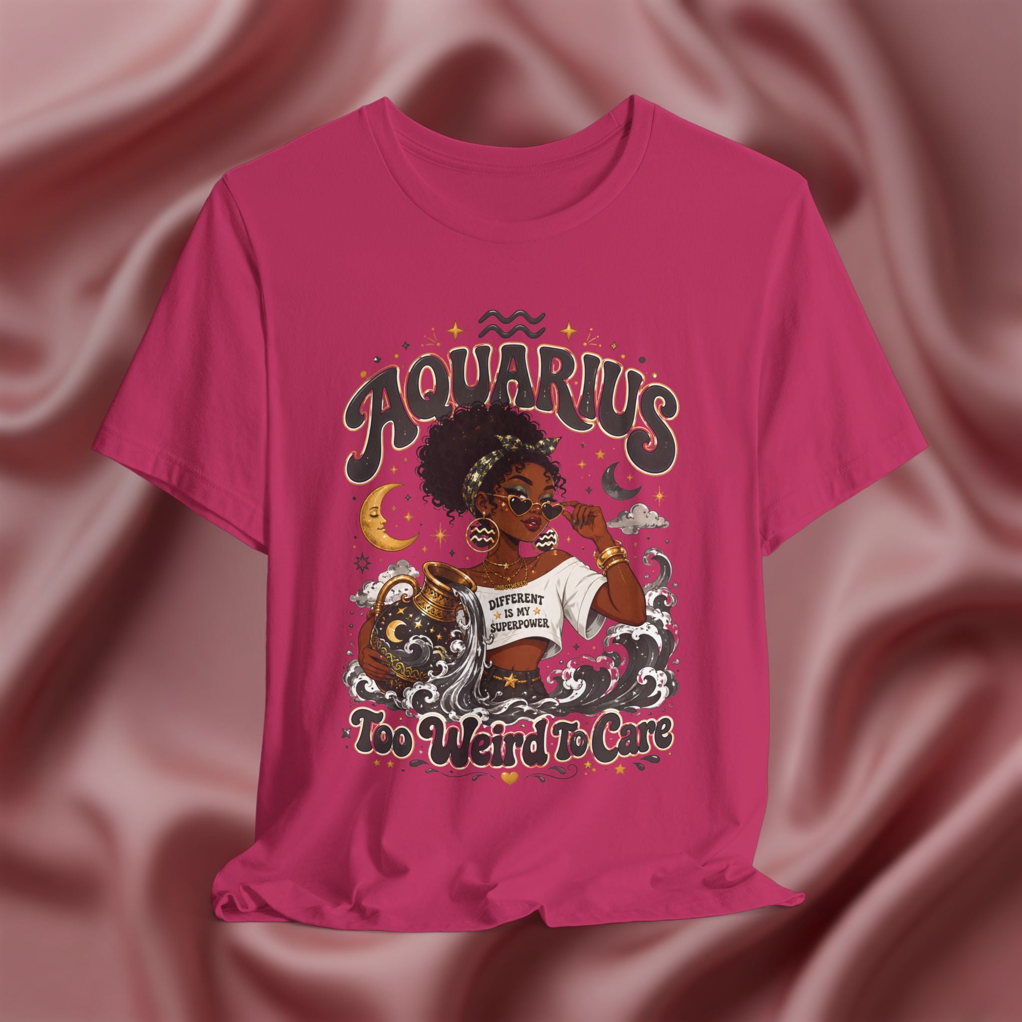Pink t-shirt with 'Aquarius Too Weird To Care' design featuring a black woman wearing a t-shirt with the text 'different is my superpower' on a pink fabric background