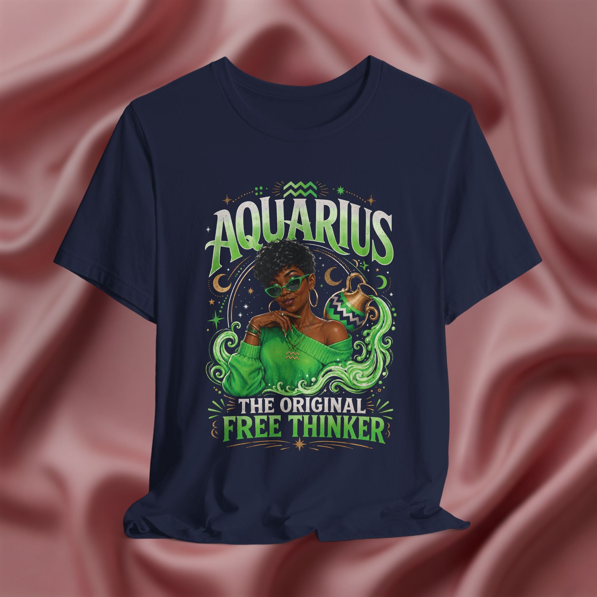 Navy blue t-shirt Pink t-shirt with Aquarius design featuring a black woman and text 'The original free thinker' on a pink fabric background