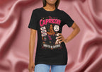 Woman wearing a black t-shirt with Capricorn design on a pink fabric background