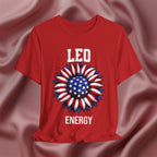 Red t-shirt with American flag sunflower and 'LEO ENERGY' text on a textured pink background