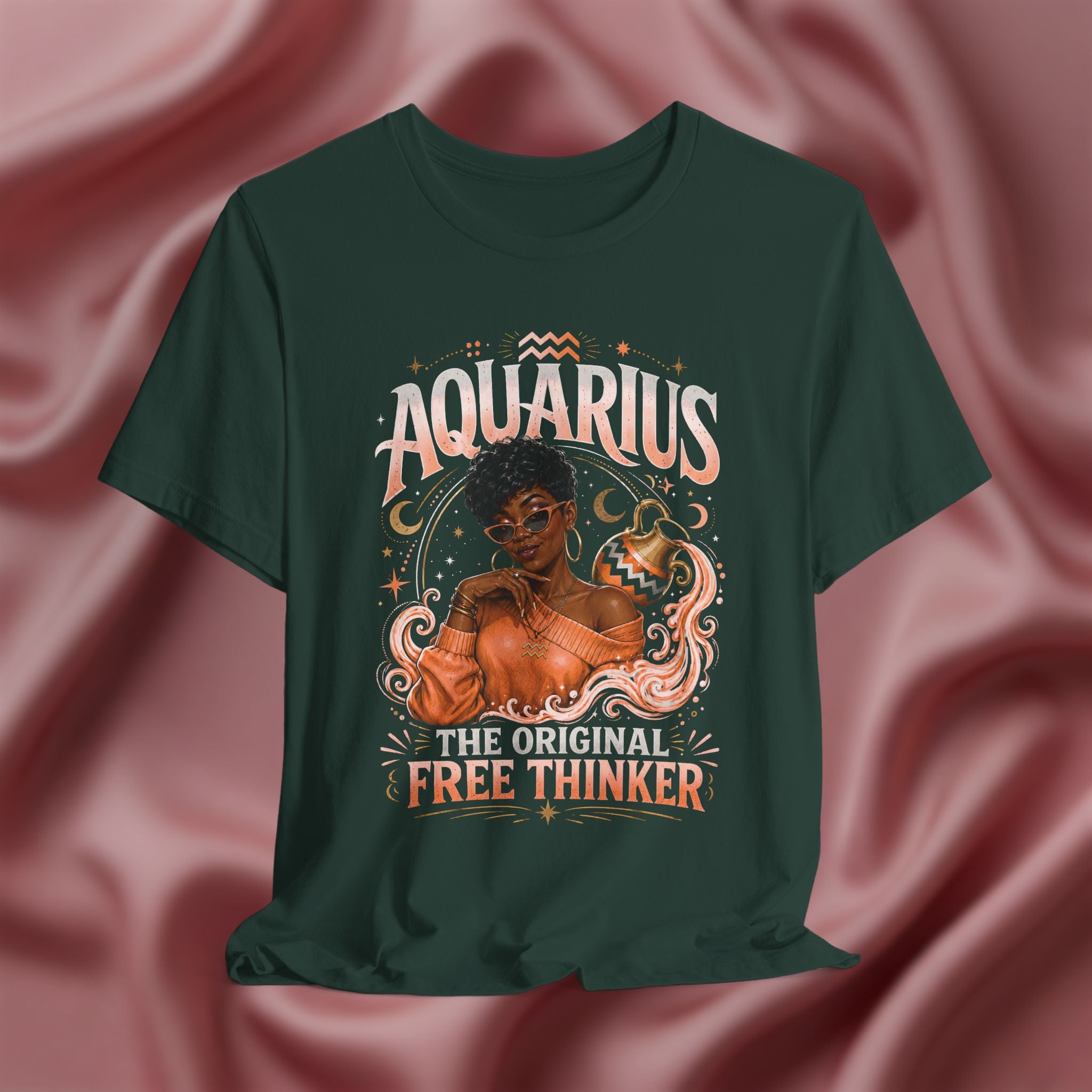 Green t-shirt with Aquarius design featuring a black woman and text 'The original free thinker' on a pink fabric background