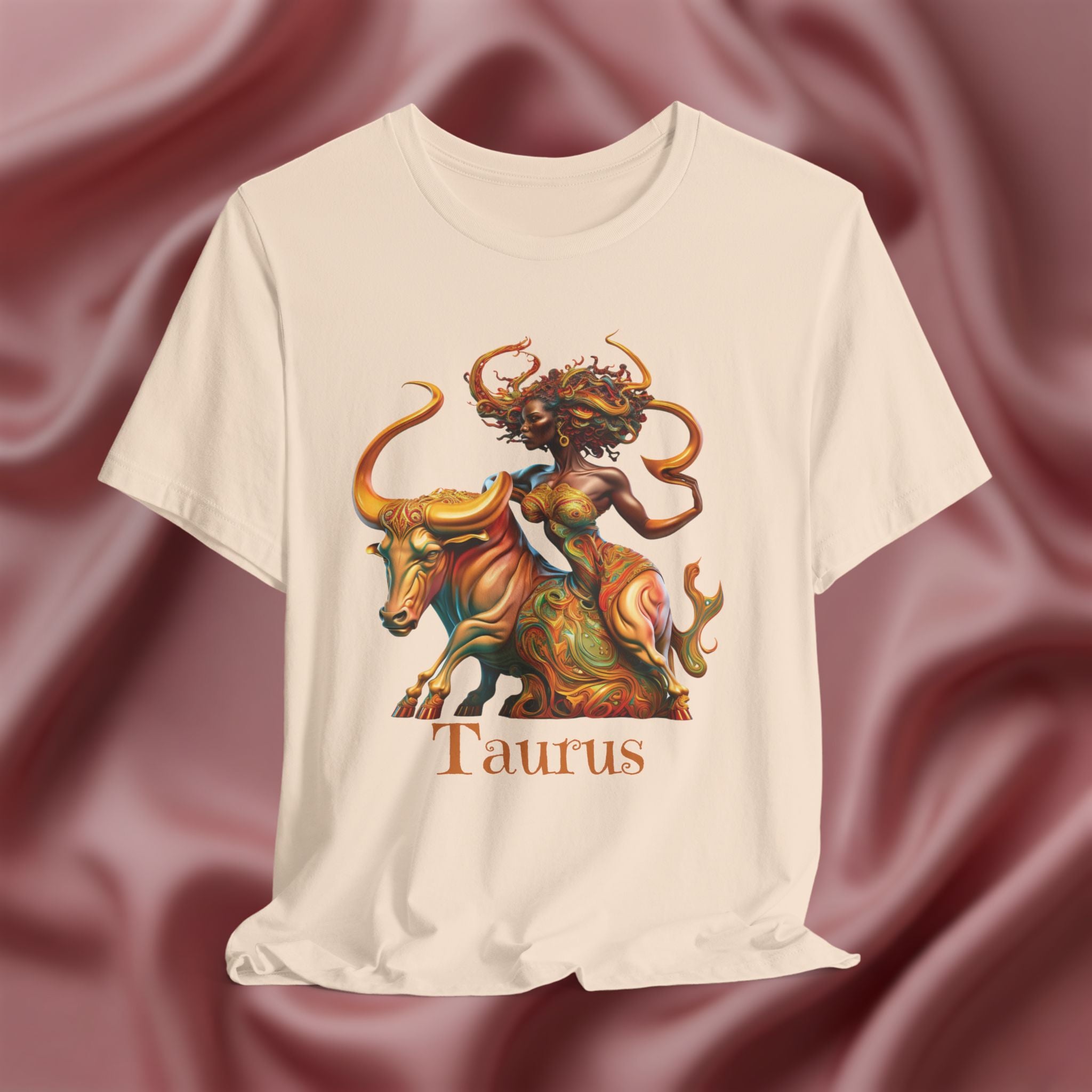 White T-shirt with Taurus zodiac design featuring a bull and black woman on a textured pink background