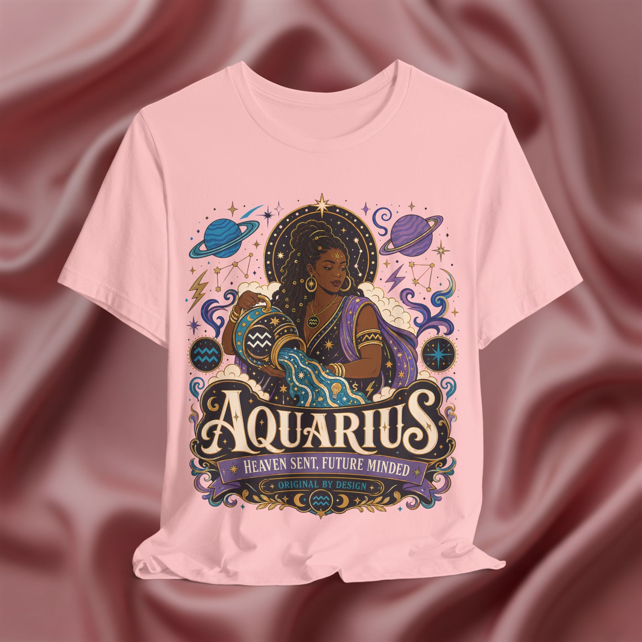 Pink t-shirt with Aquarius zodiac design on a maroon fabric background