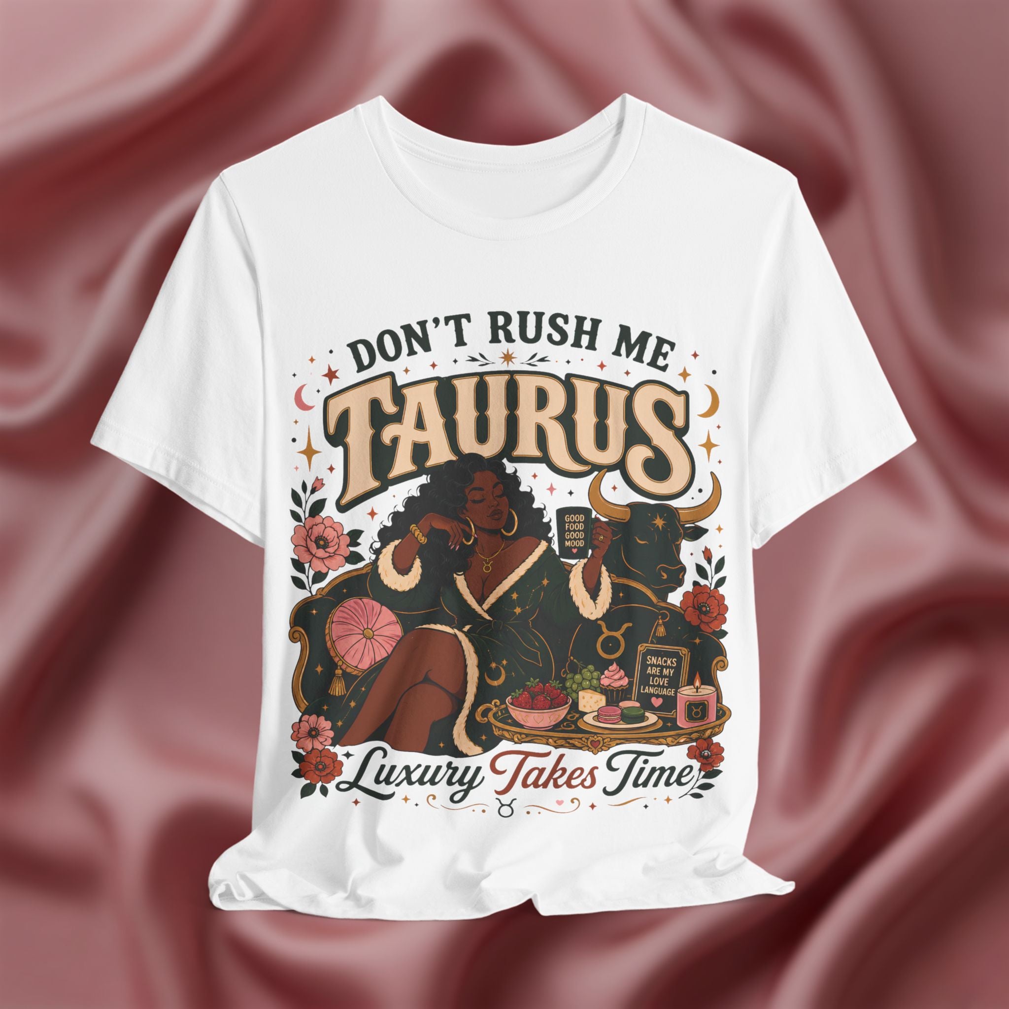 White t-shirt with 'Don't Rush Me, Taurus, Luxury Takes Time' design against a pink fabric background