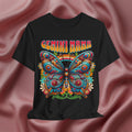 Black t-shirt with a colorful butterfly design and 'Gemini Mama' text on a pink fabric background