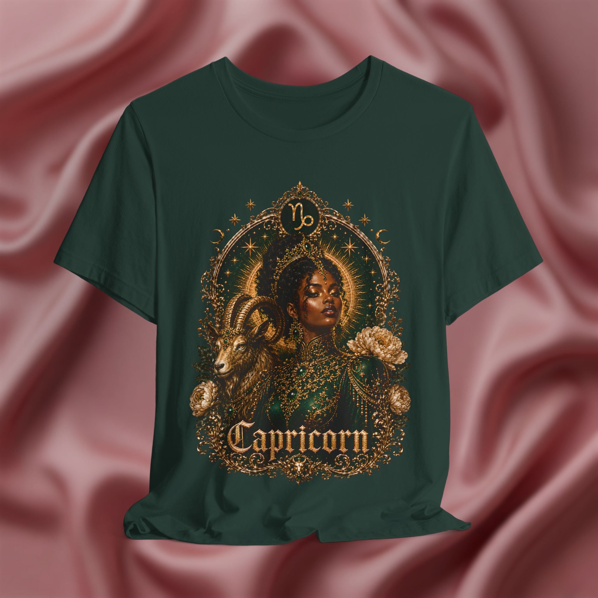 Forest green t-shirt with Capricorn design on a pink fabric background