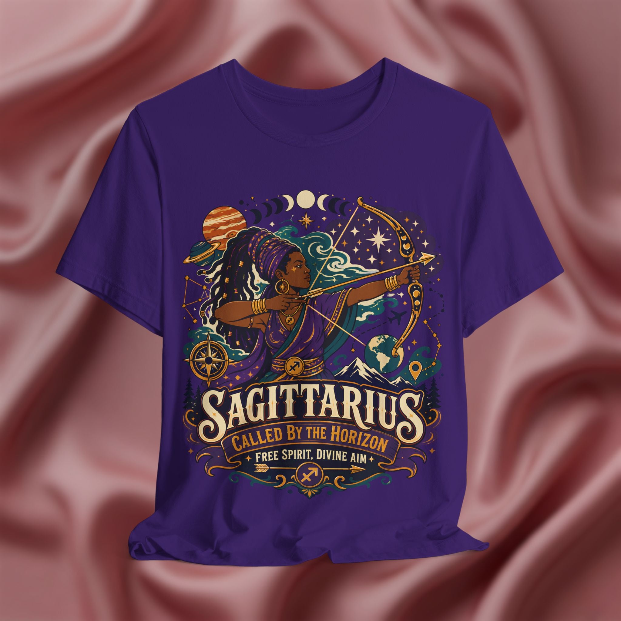 Purple t-shirt with Sagittarius zodiac design on a pink fabric background
