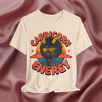 Soft Cream T-shirt with 'Capricorn Energy' design on a textured brown background