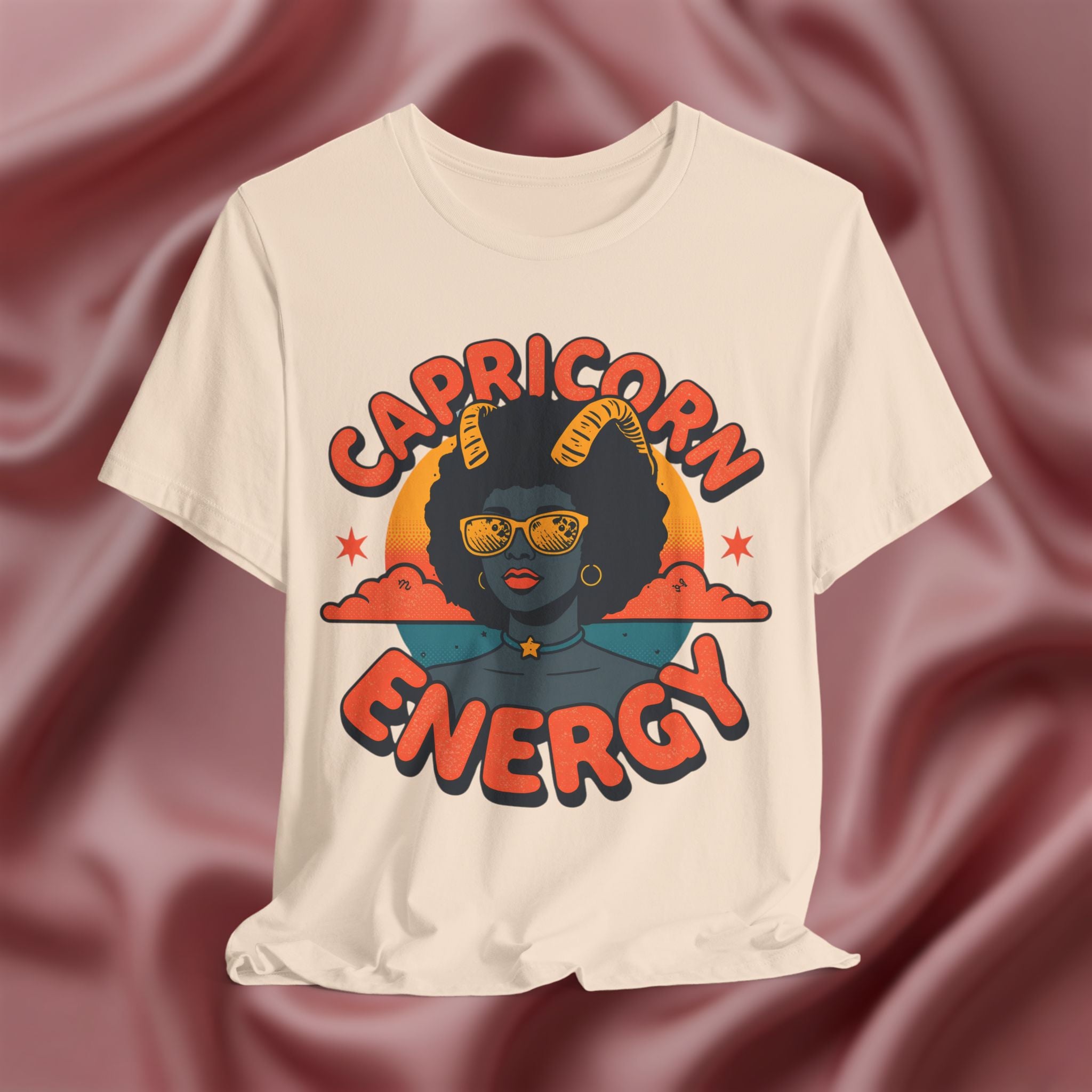 Soft Cream T-shirt with 'Capricorn Energy' design on a textured brown background