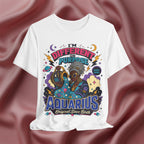 White t-shirt with colorful Aquarius-themed design on a maroon fabric background