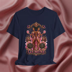 Navy blue t-shirt with Gemini zodiac design on a pink fabric background