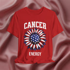 Red t-shirt with American flag sunflower and 'CANCER ENERGY' text on a textured pink background