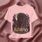 Pink T-shirt with Scorpio zodiac design on a textured red background