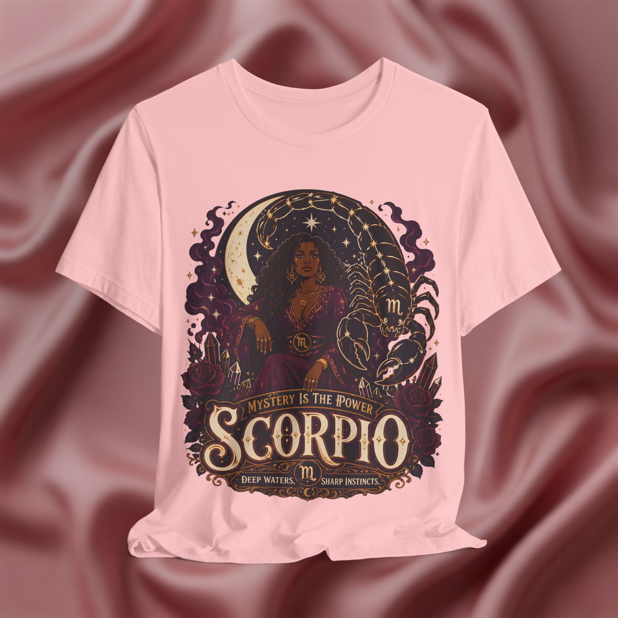 Pink T-shirt with Scorpio zodiac design on a textured red background