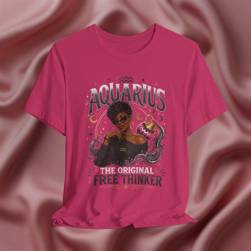 Pink t-shirt with Aquarius design featuring a black woman and text 'The original free thinker' on a pink fabric background
