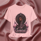 Pink t-shirt with 'Gemini' design featuring a woman and floral elements on a pink fabric background.