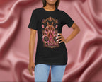 Woman wearing a black t-shirt with Gemini zodiac design on a pink fabric background