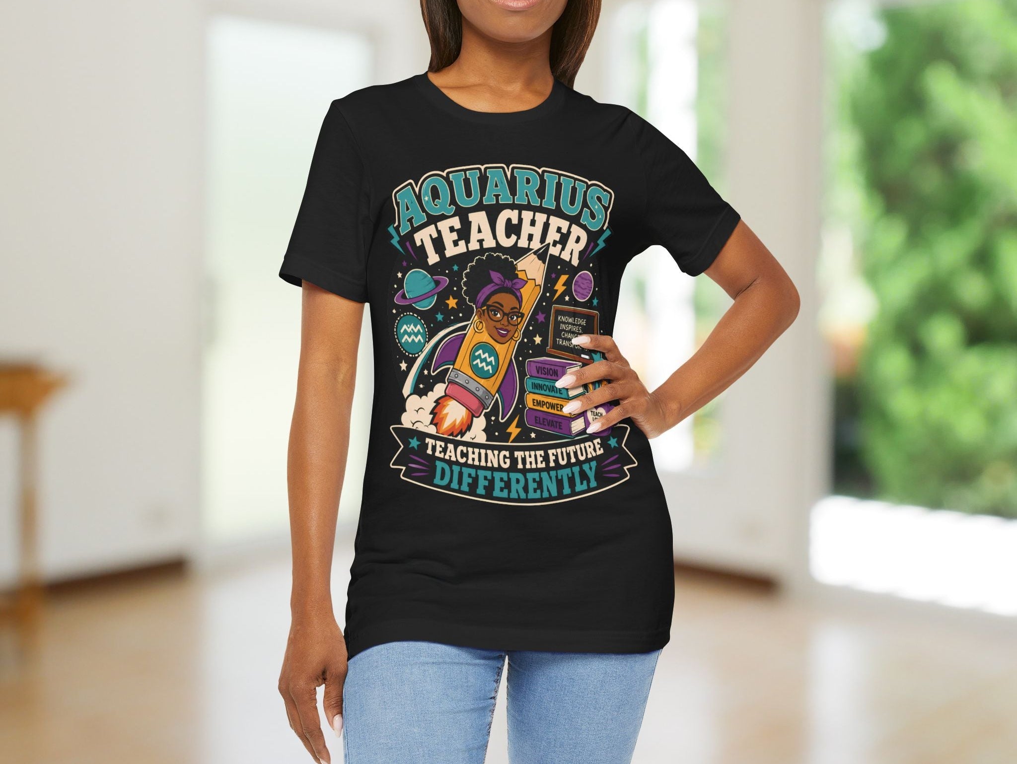 Person wearing a black t-shirt with 'Aquarius Teacher Teaching the Future Differently' design.