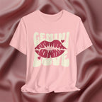 Pink t-shirt with 'GEMINI Love' and lips design on a pink fabric background