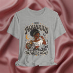Athletic Heather Gray t-shirt with 'Aquarius Too Weird To Care' design featuring a black woman wearing a t-shirt with the text 'different is my superpower' on a pink fabric background