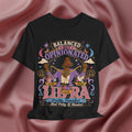 Black t-shirt with Libra zodiac design on a pink fabric background