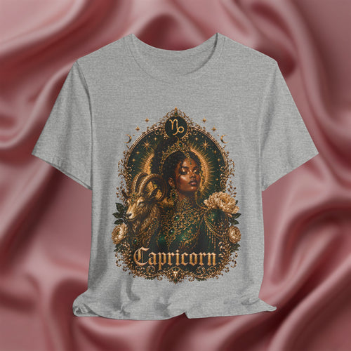 Gray t-shirt with Capricorn design on a pink fabric background
