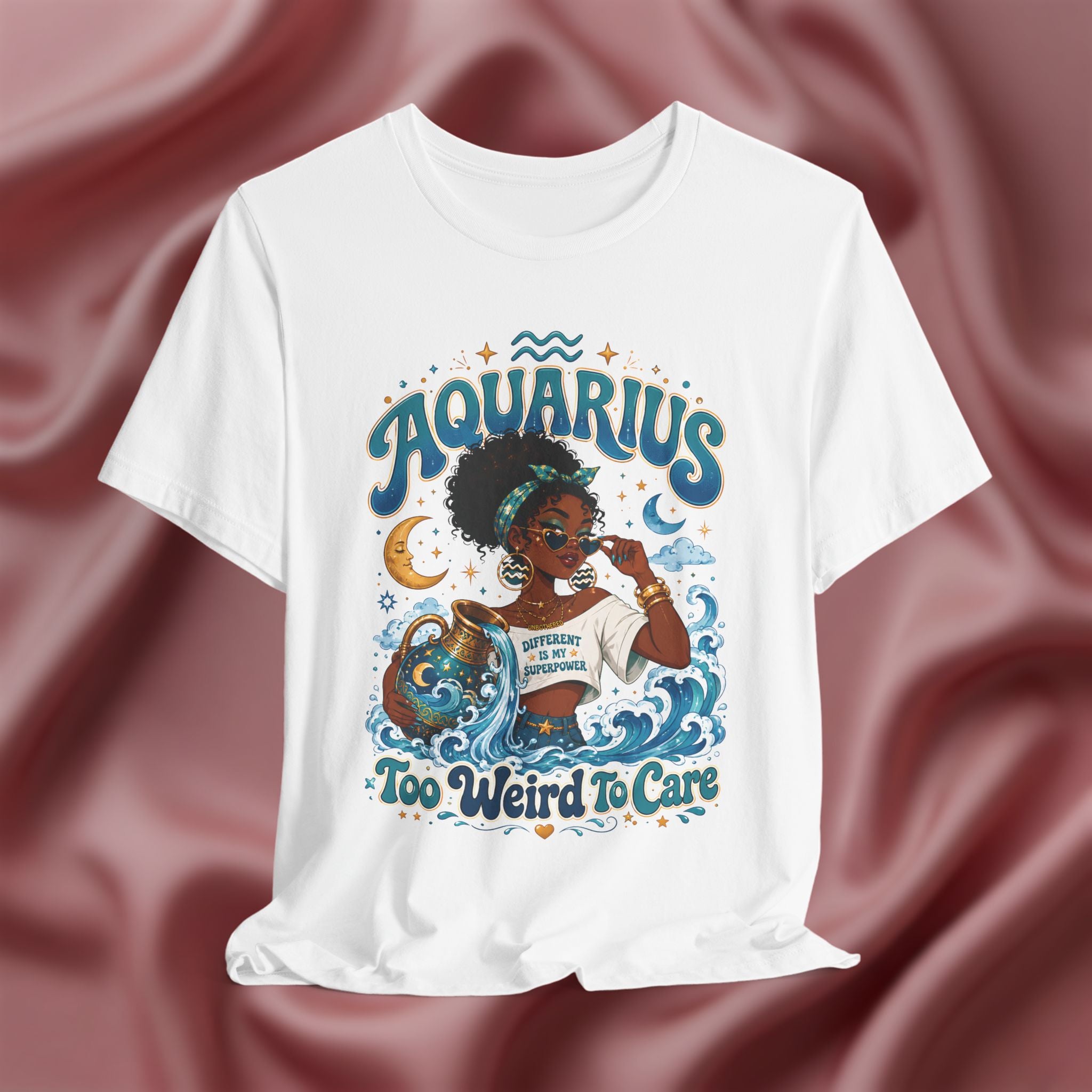 White t-shirt with 'Aquarius Too Weird To Care' design featuring a black woman wearing a t-shirt with the text 'different is my superpower' on a pink fabric background