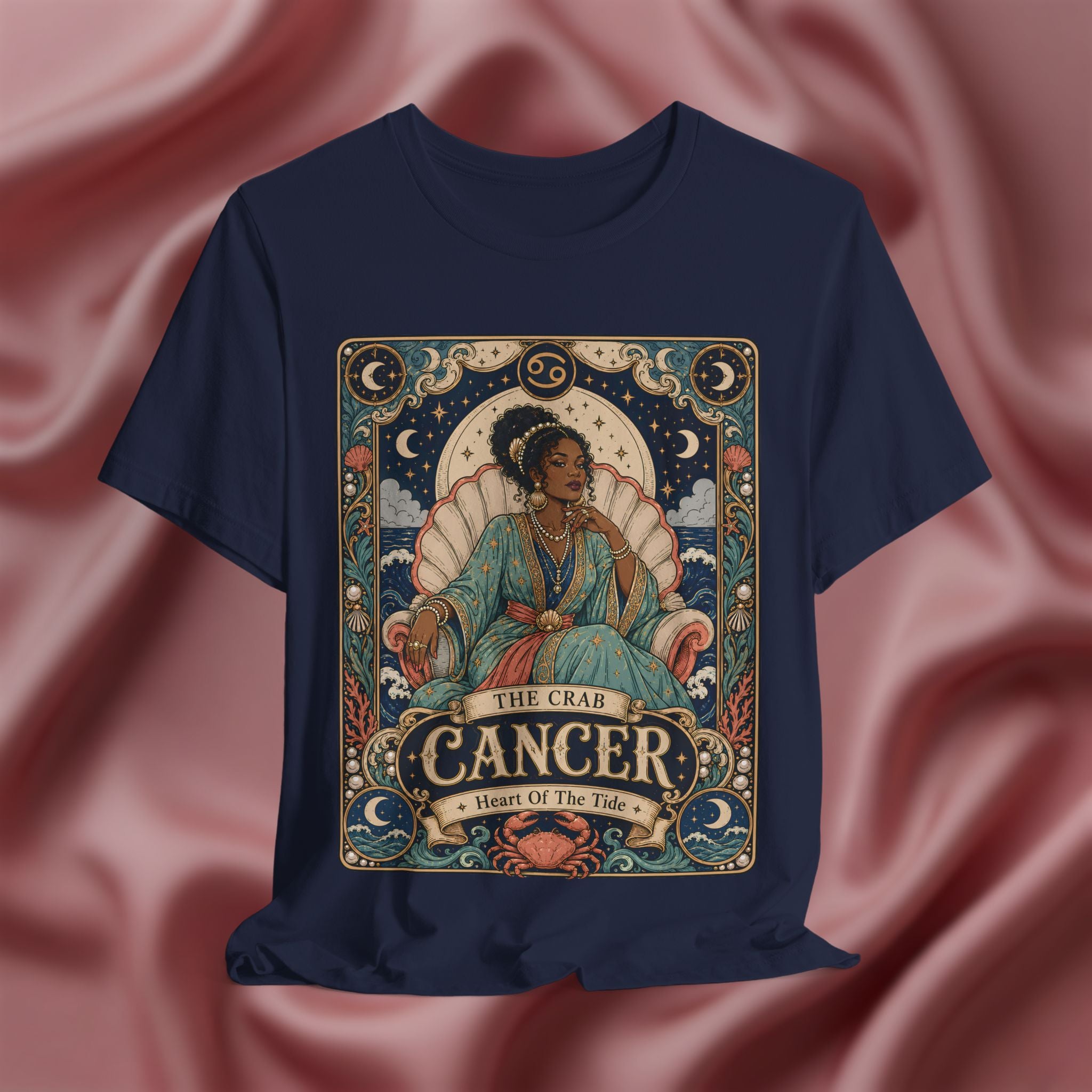 Navy blue t-shirt with Cancer zodiac design on a pink fabric background