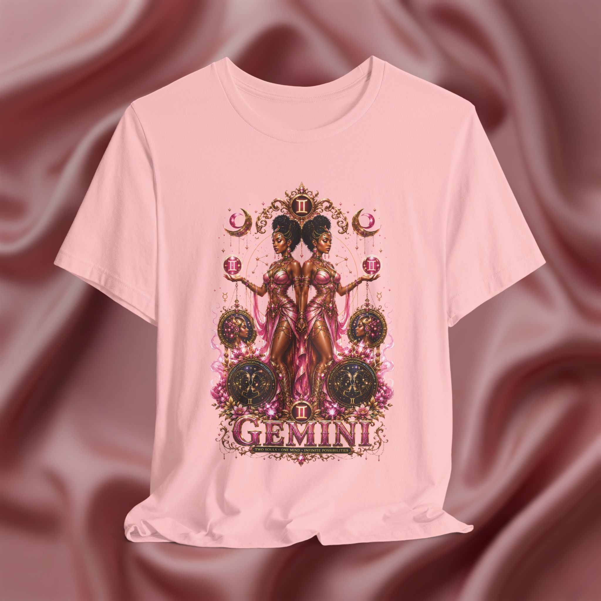 Pink t-shirt with Gemini zodiac design on a textured pink background