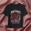 Black t-shirt with Aquarius design featuring a black woman and text 'Aquarius I'm not anti-social I'm selectively social' on a pink fabric background