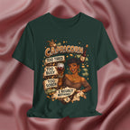 Green t-shirt with Capricorn zodiac design on a pink fabric background