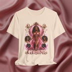 Cream T-shirt with 'Gemini' design featuring a woman in a pink dress on a pink fabric background