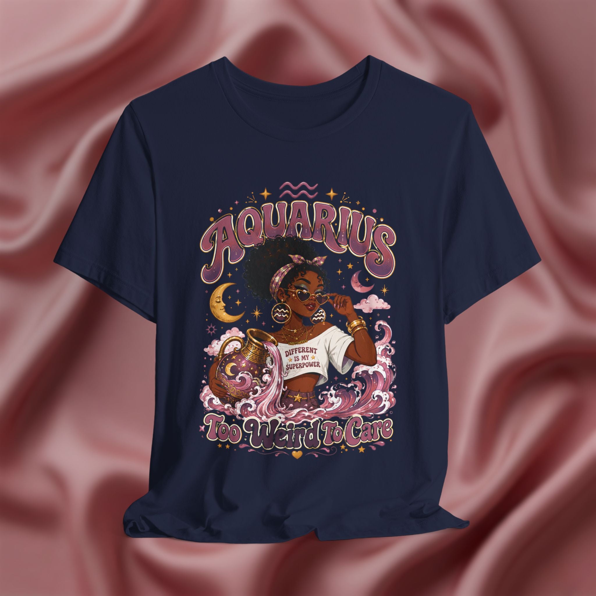 Navy blue t-shirt with 'Aquarius Too Weird To Care' design featuring a black woman wearing a t-shirt with the text 'different is my superpower' on a pink fabric background