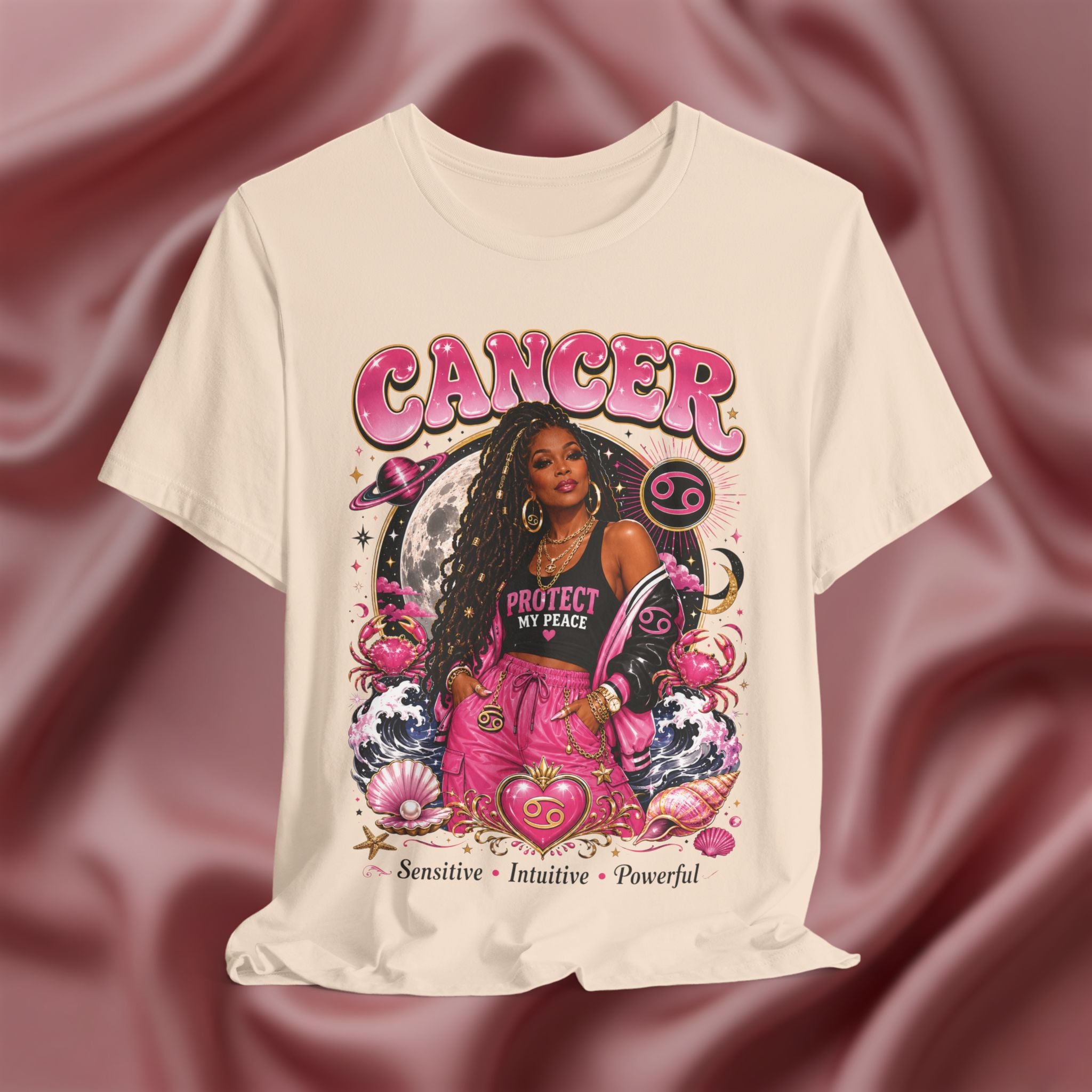 Soft cream T-shirt with Cancer zodiac design featuring a woman on a pink fabric background
