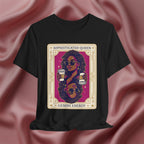 Sophisticated Queen Gemini Energy Black t-shirt with a graphic design of a woman holding coffee cups on a pink fabric background