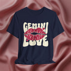 Navy blue t-shirt with 'GEMINI Love' and lips design on a pink fabric background