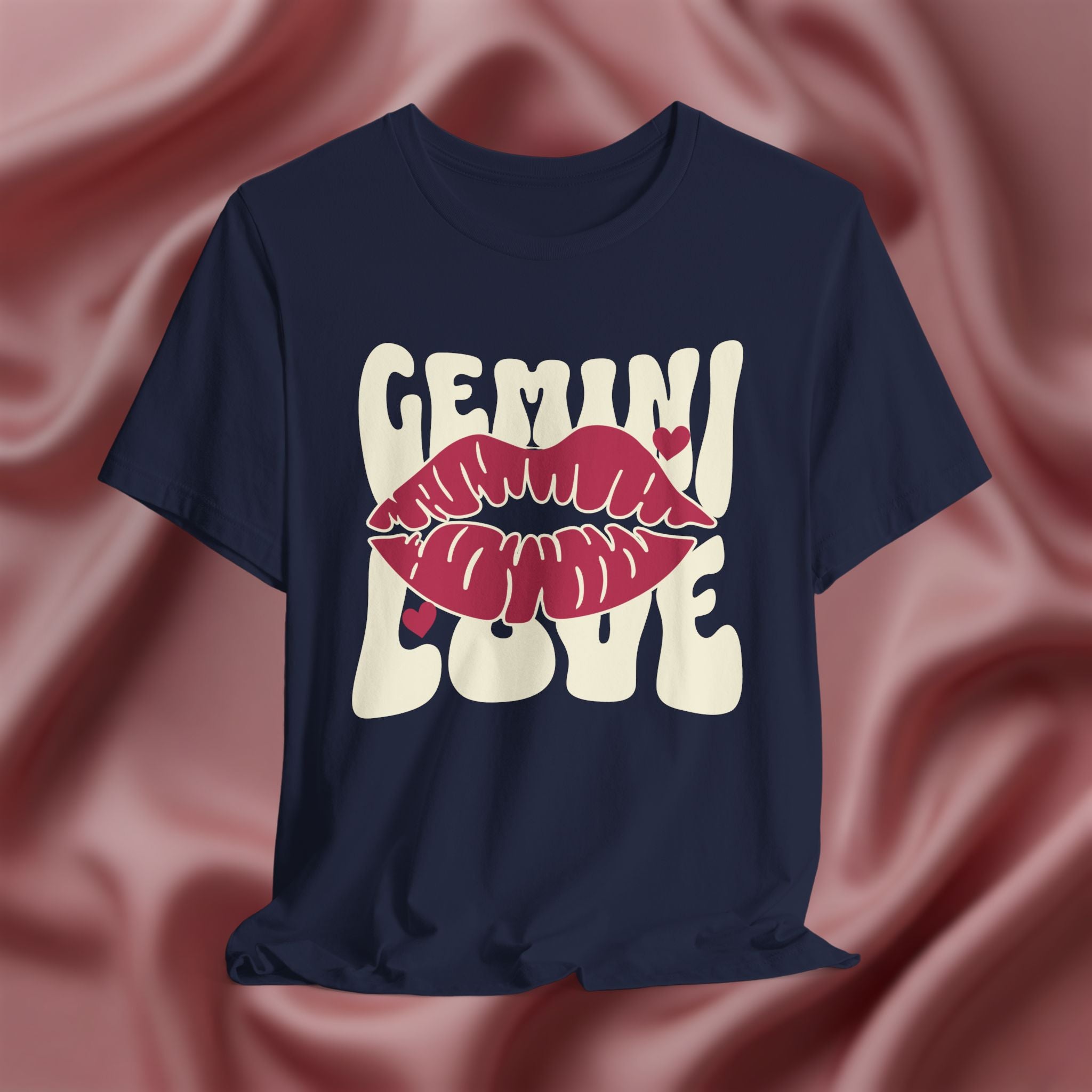 Navy blue t-shirt with 'GEMINI Love' and lips design on a pink fabric background