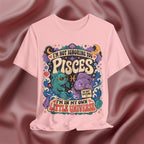Pink t-shirt with Pisces zodiac design on a maroon fabric background