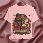 Pink T-shirt with Aries zodiac design on a textured red background