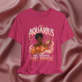 Pink t-shirt with Aquarius design featuring a black woman and text 'The original free thinker' on a pink fabric background