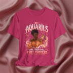 Pink t-shirt with Aquarius design featuring a black woman and text 'The original free thinker' on a pink fabric background
