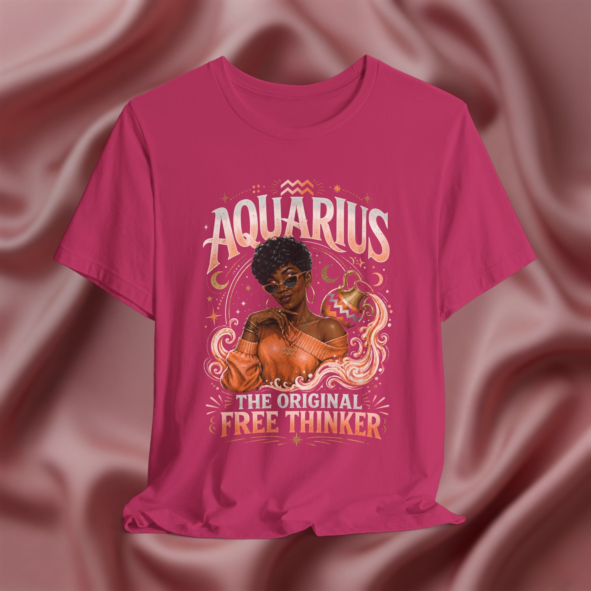 Pink t-shirt with Aquarius design featuring a black woman and text 'The original free thinker' on a pink fabric background