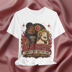 White t-shirt with Aries zodiac design on a maroon fabric background