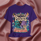 Purple t-shirt with Pisces zodiac design on a pink fabric background