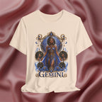 Soft Cream t-shirt with a 'Gemini' design featuring a woman in a blue dress on a maroon fabric background.
